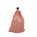 Detail view of a durable pink mesh drawstring bag for reusable plastic ice cubes - Pack of 48 (24.5x17cm) / Pink
