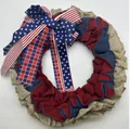 Detail view of patriotic Independence Day burlap wreath with star and stripe ribbon bow - Style A / Red Blue Beige