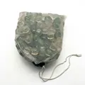 Close-up of green reusable plastic ice cubes in a white mesh drawstring bag - Pack of 150 (30x25cm) / Colorful