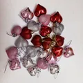 Close-up of assorted colorful heart-shaped ornaments with glitter and shiny finish - Set of 24