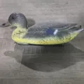 Detailed side view of a realistic plastic duck decoy for garden pond decoration - New Female Duck