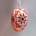 Macro detail of Easter egg ornament with intricate orange floral pattern and ribbon - Orange European Vintage Style (Style 5)