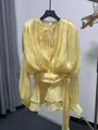 Elegant yellow long sleeve loose dress with chic waist tie and flowing ruffle hem details - Yellow