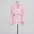 Pink long-sleeve loose pleated mini dress with tie ribbon detail and layered hemline - Light Pink