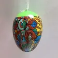 Detailed view of a colorful Easter egg hanging ornament with vibrant floral patterns - Painted Flora Green Top Style (Style 3)