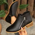 Eleganti stivaletti neri in pelle da donna con zip laterale e suola in gomma marrone - Nero