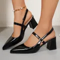 Detail view of black pointed-toe slingback Mary Jane pumps with a sturdy block heel. - 36 / Black