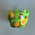 Detailed view of green non-woven felt Easter basket featuring fence design and hen motif - Green Double Chicken 2
