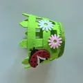 Detail view of Easter felt fence basket with ladybug and daisy applique decorations - Green Ladybug
