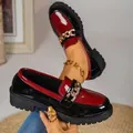 Chic red and black patent leather loafers featuring gold chain detail and platform lug sole - 36 / Red