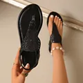 Dettaglio dei sandali infradito neri con paillettes scintillanti per donna da mare - 36 / Nero