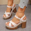 Close-up of stylish off-white platform sandals with a 10.5cm chunky heel and strap. - 35 / Beige