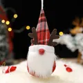 Handmade Christmas gnome ornament featuring a red plaid hat and antlers for holiday decor - Red
