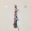 Patriotic red white and blue wooden bead garland with silver star and tassel detail view - Independence Day Beaded House Style with Ball