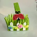 Detailed view of Easter felt basket featuring a cute ladybug and garden fence design - Ladybug Style