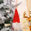 Festive red knitted Christmas gnome hanging ornament on a snowy tree for holiday decor - Style D