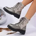 Detail of sparkling metallic silver Martin boots with sequins and thick black platform sole - 36 / Gunmetal