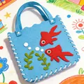 Detail of blue felt children's DIY bag with red goldfish decorations - Fish Style