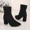 Detailed view of black suede block heel ankle boots with elegant pointed toe design - 34 / Black