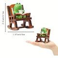 Miniature green frog on rocking chair figurine with dimensions of 2.4x1.57 inches - Frog on Rocking Chair Ornament