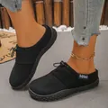 Close-up of black suede mule shoes with drawstring detail and comfortable soft sole. - 36 / Gray