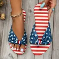 Close-up detail of women's flip-flops featuring an American flag stars and stripes bow - 36 / Blue