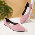 A pair of elegant pink suede pointed-toe flat ballet shoes displayed on a white table. - Pink