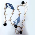 Detailed macro view of Mediterranean style wooden mermaid wall hanging with shells and bells - Small Mermaid Long Style