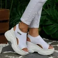 Stylish white fly-knit platform sandals with chunky soles and fashion patch detail. - 36 / White