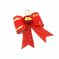 Detailed view of red double-layered 3D Christmas bow with gold glitter and Merry Christmas tag - 9# (11x9cm) / Red