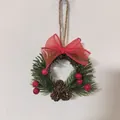 Mini Christmas wreath featuring a red ribbon bow, pinecones and berries for wall decor. - Style E / 8cm Diameter