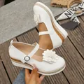 Elegant white platform Mary Jane shoes featuring a stylish flower accent for women - 36 / White