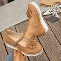 Stylish tan platform wedge shoes for women featuring elegant flower applique and buckle strap - 36 / Dark Brown