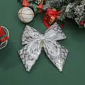 Detailed view of silver woven Christmas bow ornament on festive green background - Gray 425 (328.10) / 20*25cm / Gray