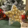 Detailed view of 4cm gold and clear Christmas ornaments in a star-shaped box - Gold and Transparent Set (W5399) / Pentagram Box (26x26cm)