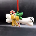 Décoration de Noël en résine en forme d'os de chien avec nœud doré et empreinte de patte. - Style d'Os à Nœud / Blanc