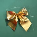 Goldener Weihnachts-Schleifen-Dekor mit Maßen von 9 cm Breite und 10 cm Länge - 300 Stück/Packung (9cm) / Gold