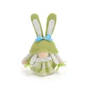Close-up of a green Easter bunny gnome plush toy with white braids and blue bow - Female Style