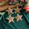 Close-up detail of four golden hollow star ornaments for Christmas tree decoration - 4 Pcs (8cm) / Painted Gold