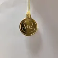 Close-up of gold St. Patrick's Day coin ornament with top hat design - Gold (Single)