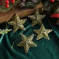 Set of four golden hollow star Christmas tree ornaments on dark green velvet background - 4 Pcs (8cm) / Gold