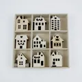 Detailed view of nine unique wooden house-shaped DIY craft decorations in a grid box. - 9 Mixed Styles (Wooden Grid Box - House)