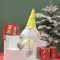Detail view of a handcrafted Christmas gnome plush with yellow sequined hat and beard - Hat Style 5 / 16x33cm