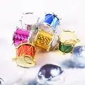 Detail view of colorful laser-finish mini drums Christmas tree ornaments - 5cm / Set of 6