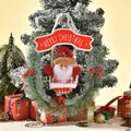 Festive Christmas pine needle wreath ornament featuring a plush Santa Claus and red banner - Santa Claus Style (195A) / 27x32cm