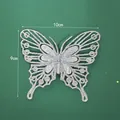 Detailed view of silver glitter butterfly decoration with 10x9cm size markings. - 10cm / Silver