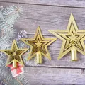 Three sizes of golden glittery Christmas tree toppers on a rustic wood background - 10cm / Gold