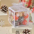 Close-up of a clear PVC Christmas gift box filled with red ornaments and pinecones - Pinecone and Red Ball Set (wrb544128) / 8x8x8cm