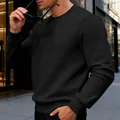Detail of black men's waffle textured crew neck long sleeve sweatshirt on model in street - S / Tops / Black