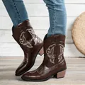 Detailed view of dark brown women's western cowboy boots with intricate white embroidery - 36 / Coffee